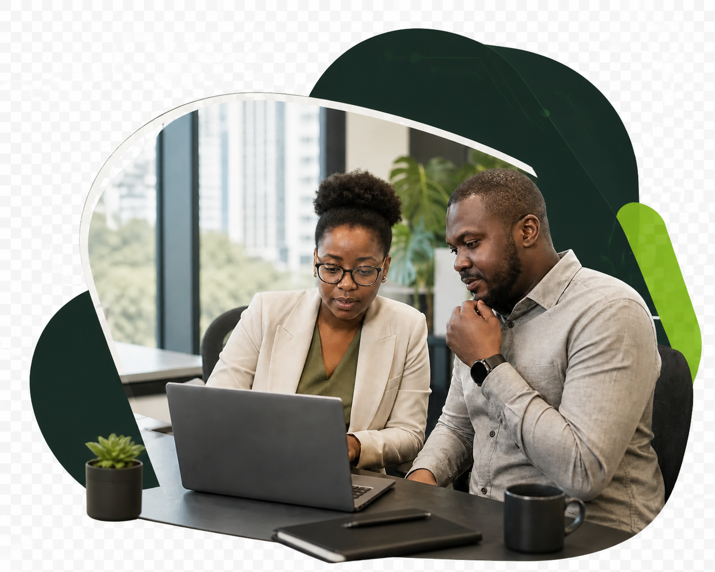 Two African technology professionals collaborating at a workstation in a modern office